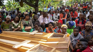 Ugandans bury more victims of horrific school massacre