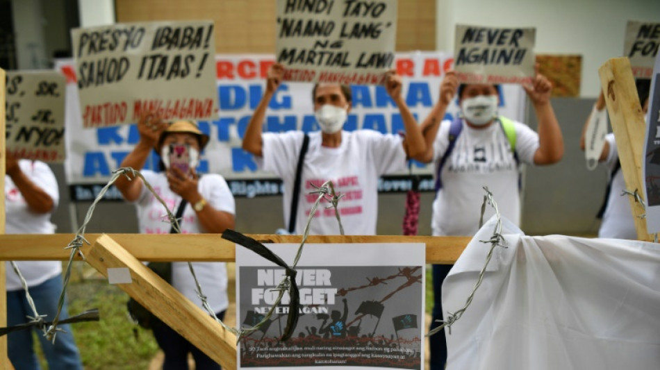 Philippine protesters vow to 'never forget' Marcos era abuses