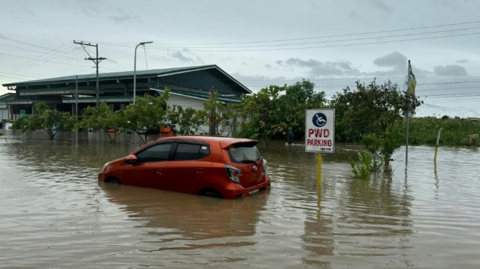 Thousands flee homes as fierce tropical storm batters Philippines