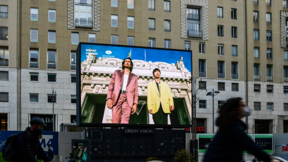 Men's fashion week goes live in Milan, buoyed by upbeat sales