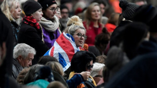 'I was part of it': hushed crowds pack London for queen's funeral