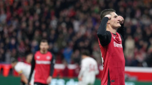 Schick hits four as Leverkusen close gap to Bayern on sombre weekend 